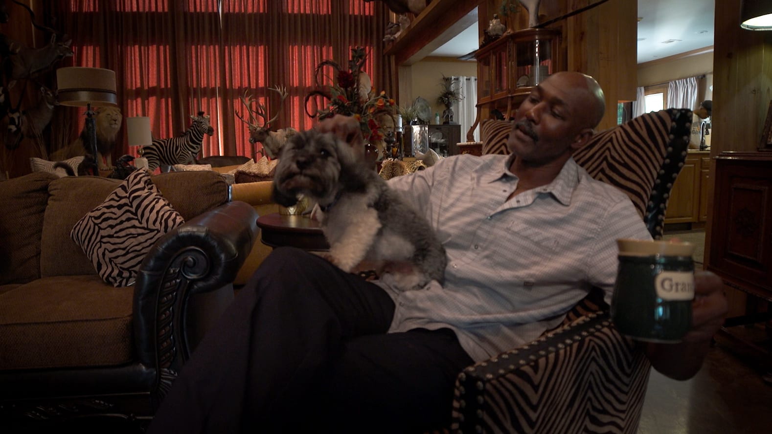 Karl Malone spends some quality time at home with his dog and his coffee. (Amir Ebrahimi)
