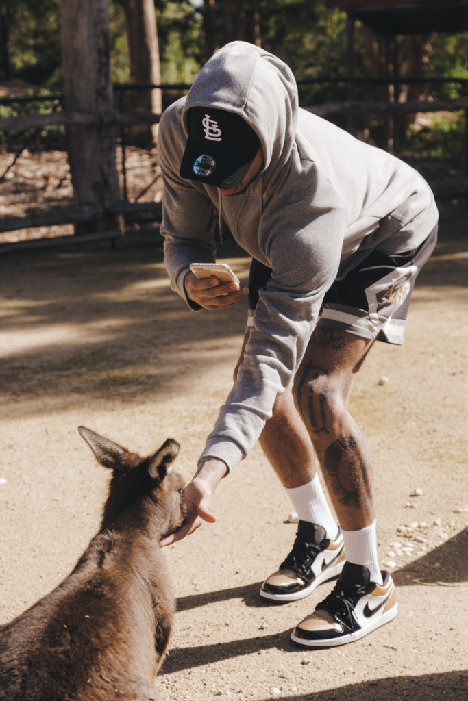 Jayson feeds a wallaby at the Melbourne Zoo.